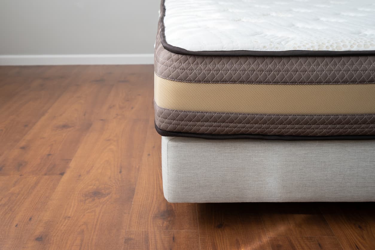 Hotel bed base manufacturer in Turkey showcasing a durable upholstered hotel bed base with quilted side panels.