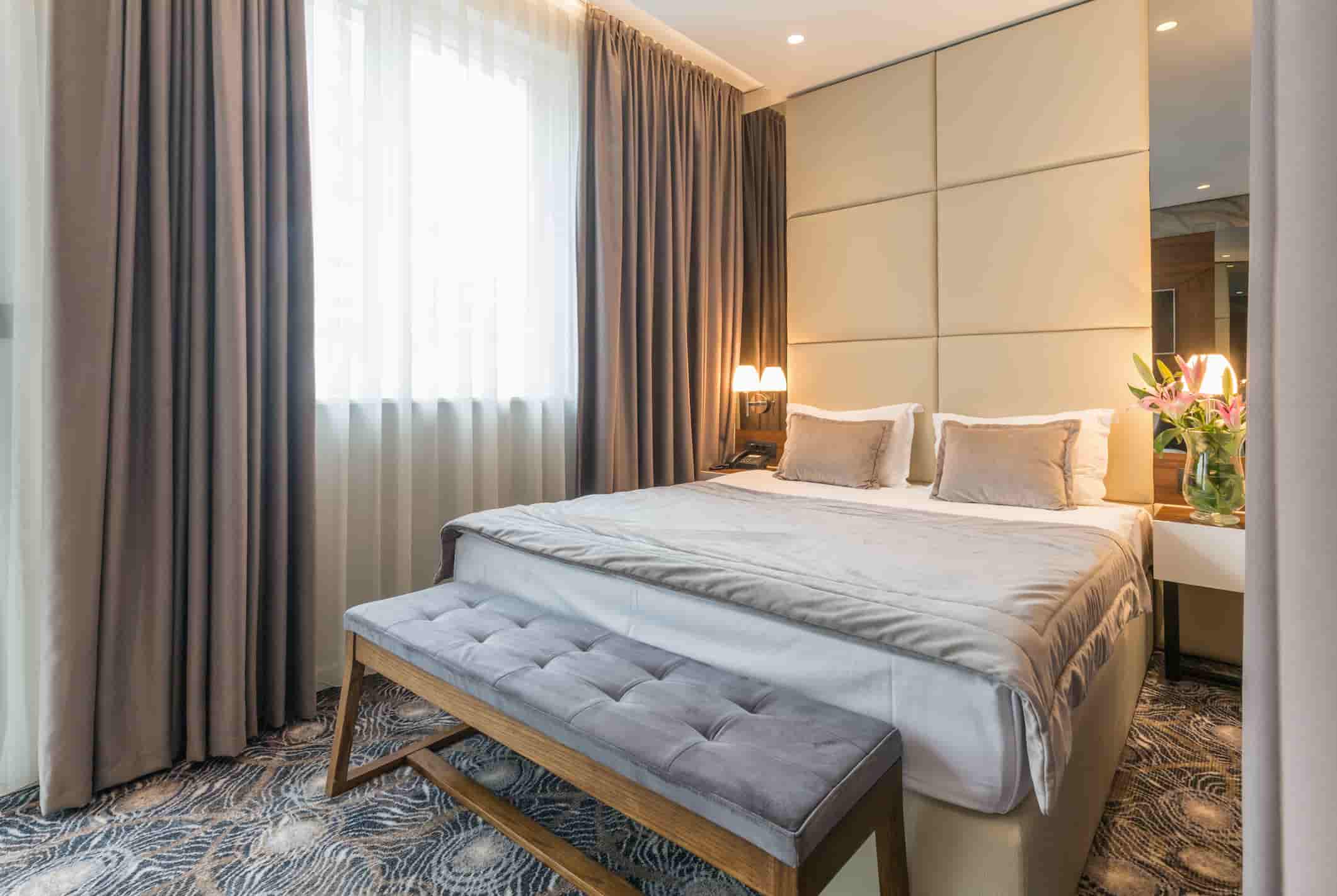 hotel guest room set with ottoman