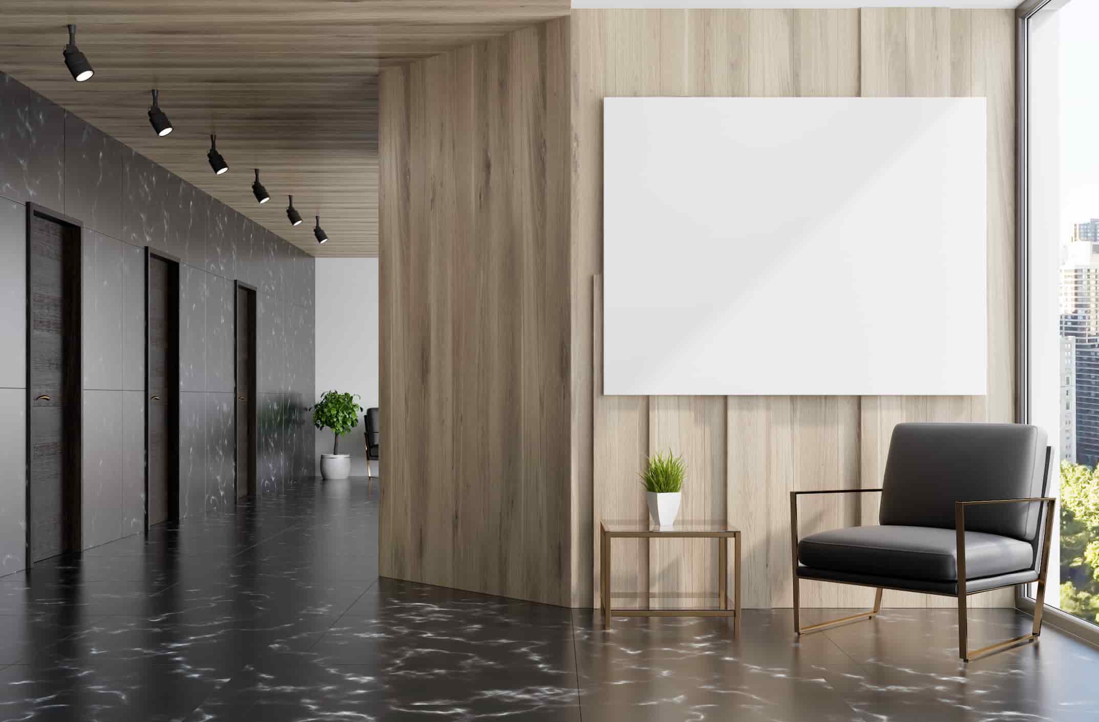 Modern hotel corridor lounge with wood wall panels, accent chair, side table, and minimalist interior design.