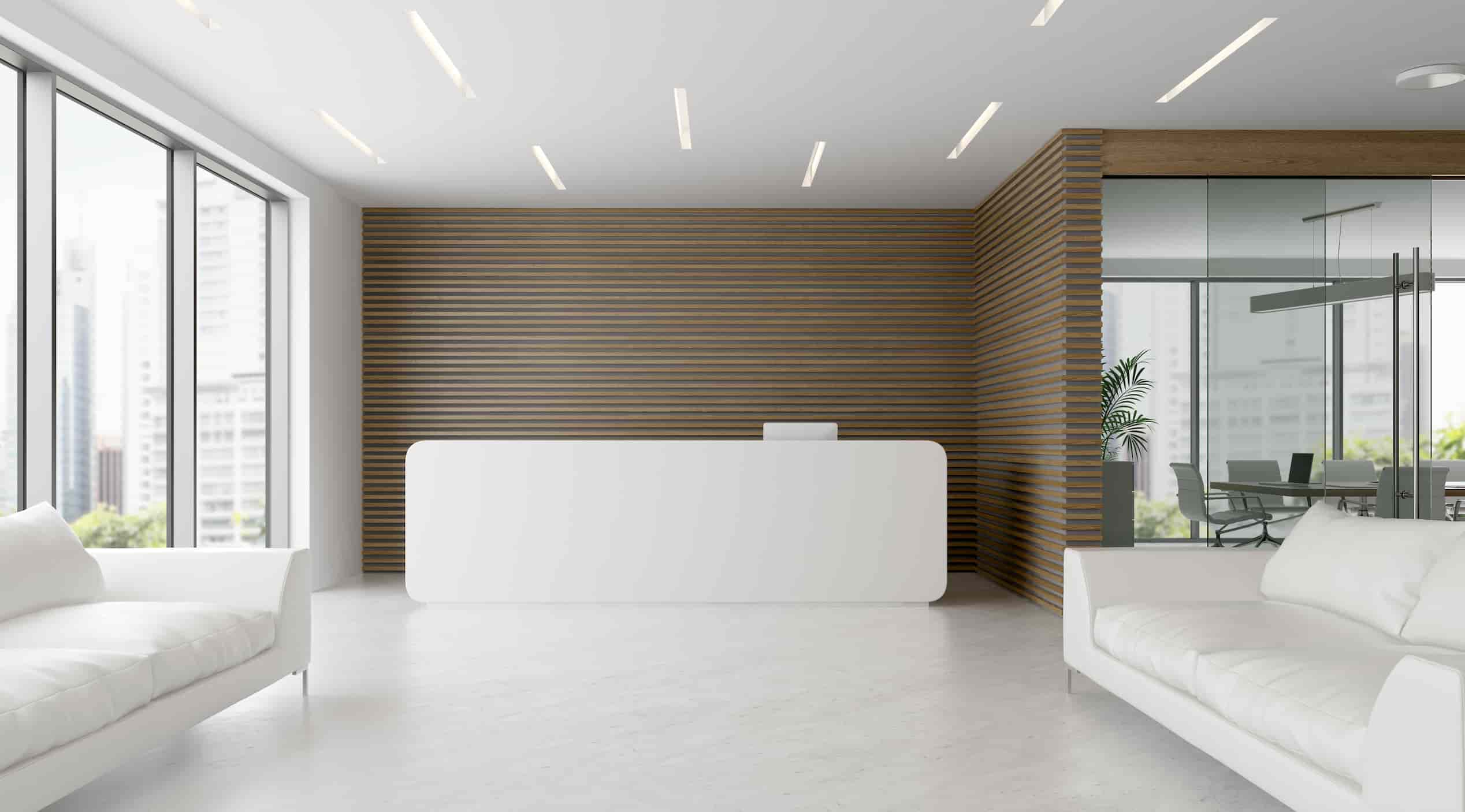 white sofas with white reception desk