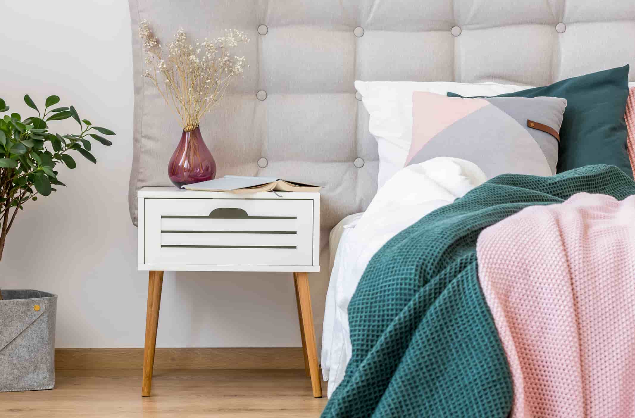 Hotel nightstand manufacturer in Turkey featuring white bedside table with drawer and wooden legs for hotel rooms.