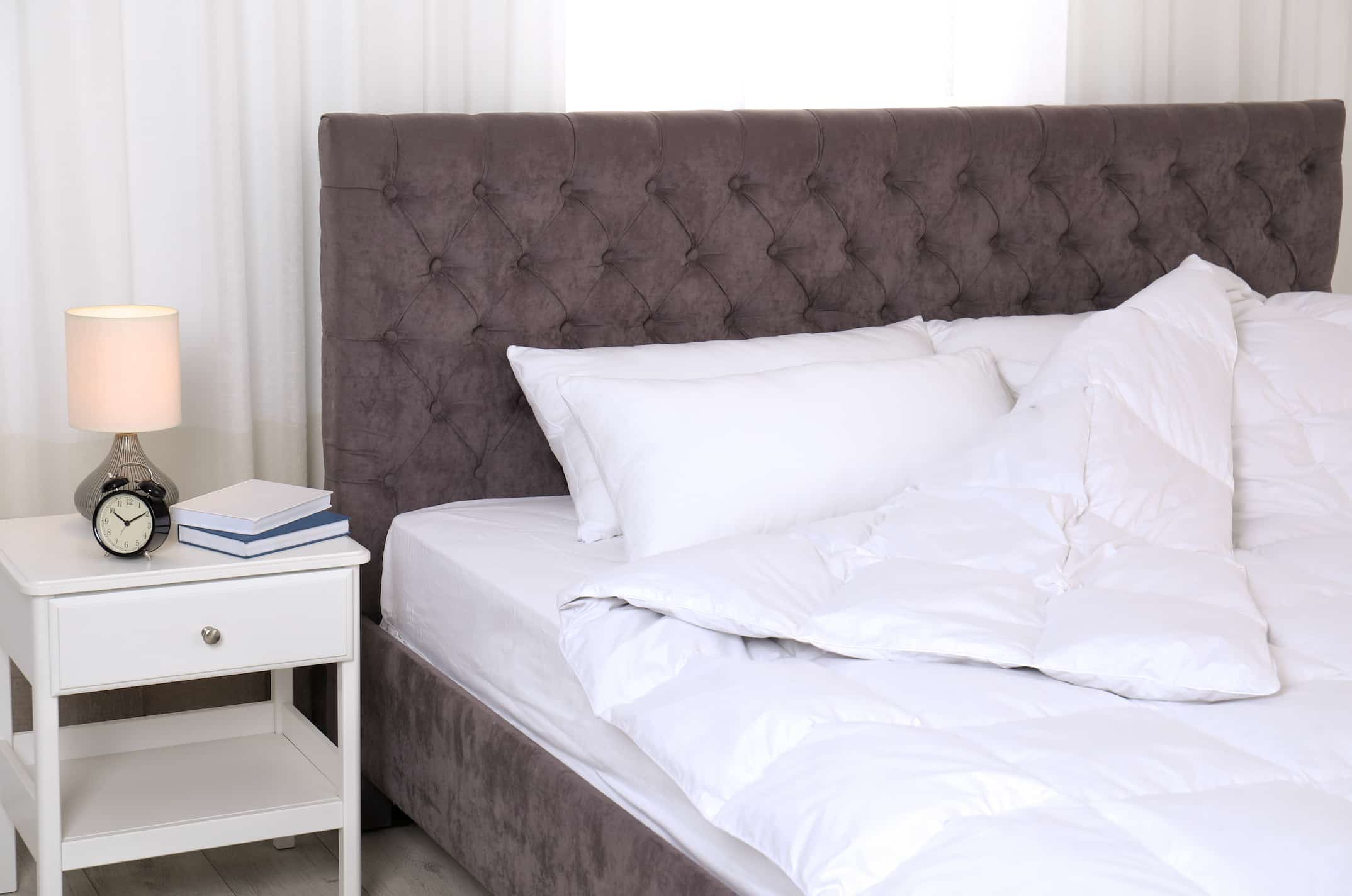 hotel nighstand near hotel bed