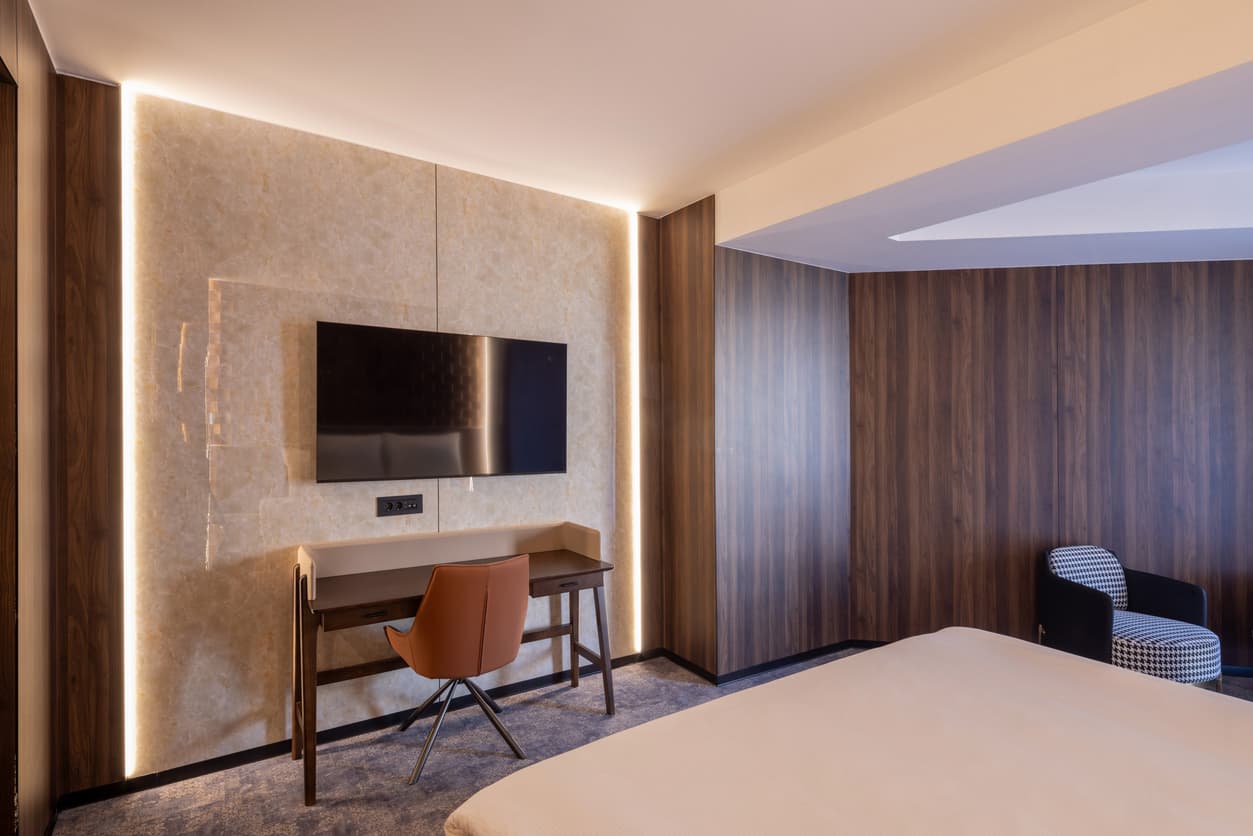 Hotel TV unit with integrated writing desk and wall panel, custom-made for hotel projects in Turkey