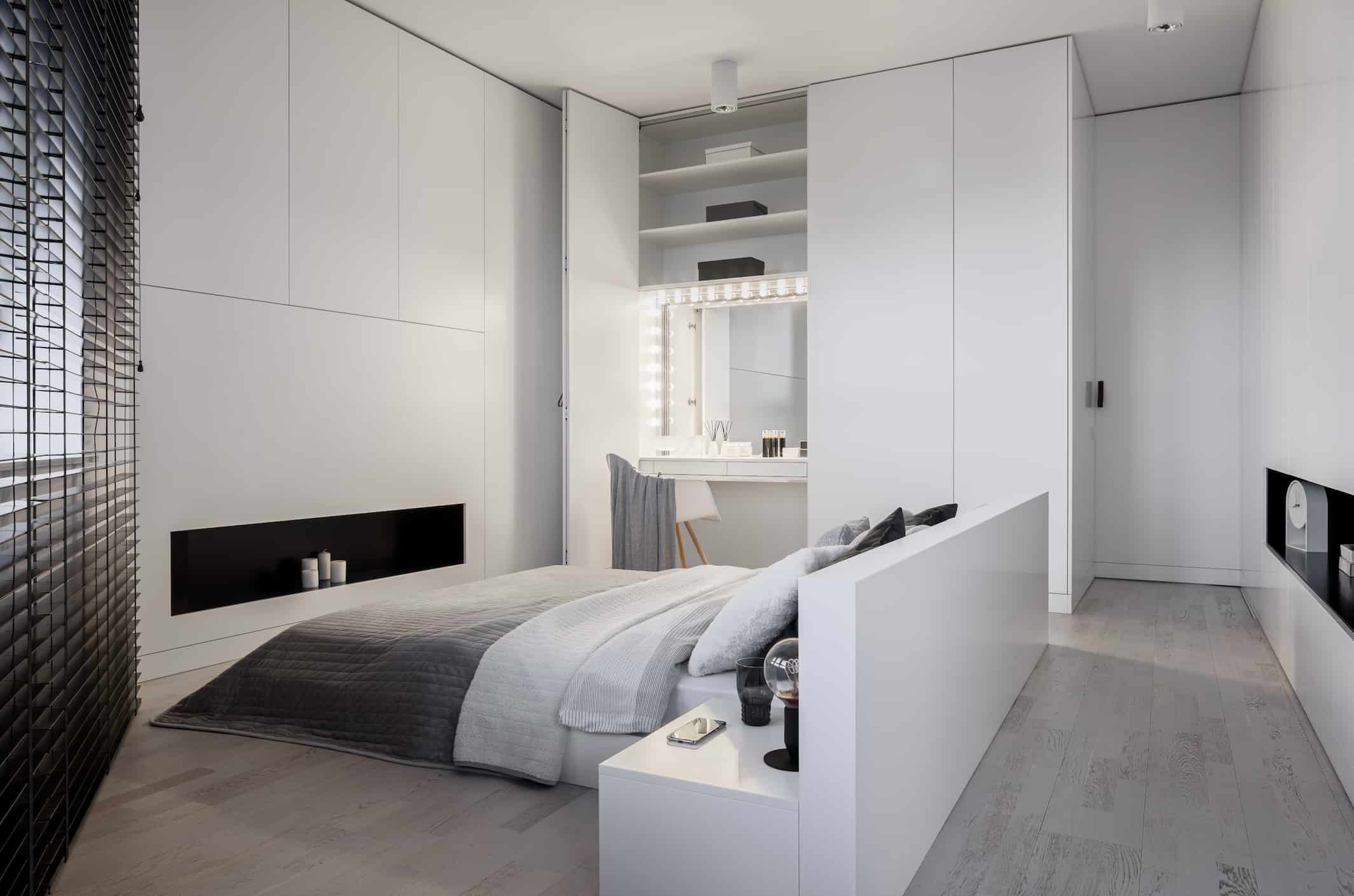 Hotel wardrobe manufacturer in Turkey showcasing a custom white built-in wardrobe with vanity unit in a modern hotel room.