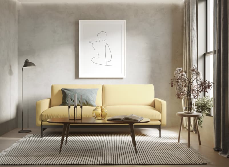Modern hotel suite sofa with coffee table and soft neutral tones